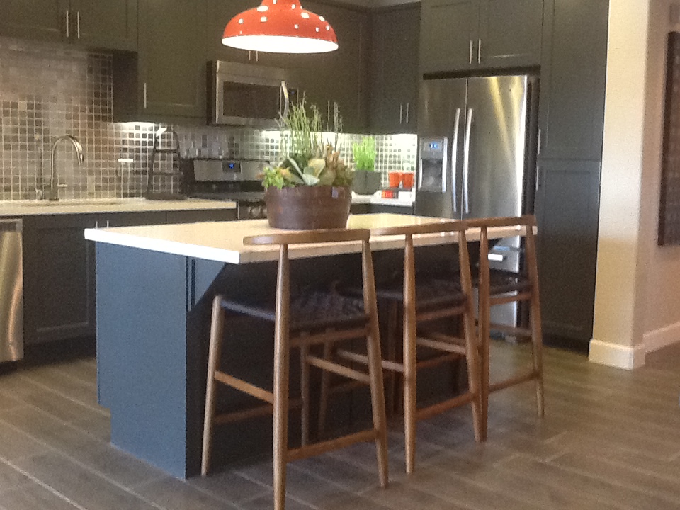 Now: square-edged granite tops with staggered long planked flooring.